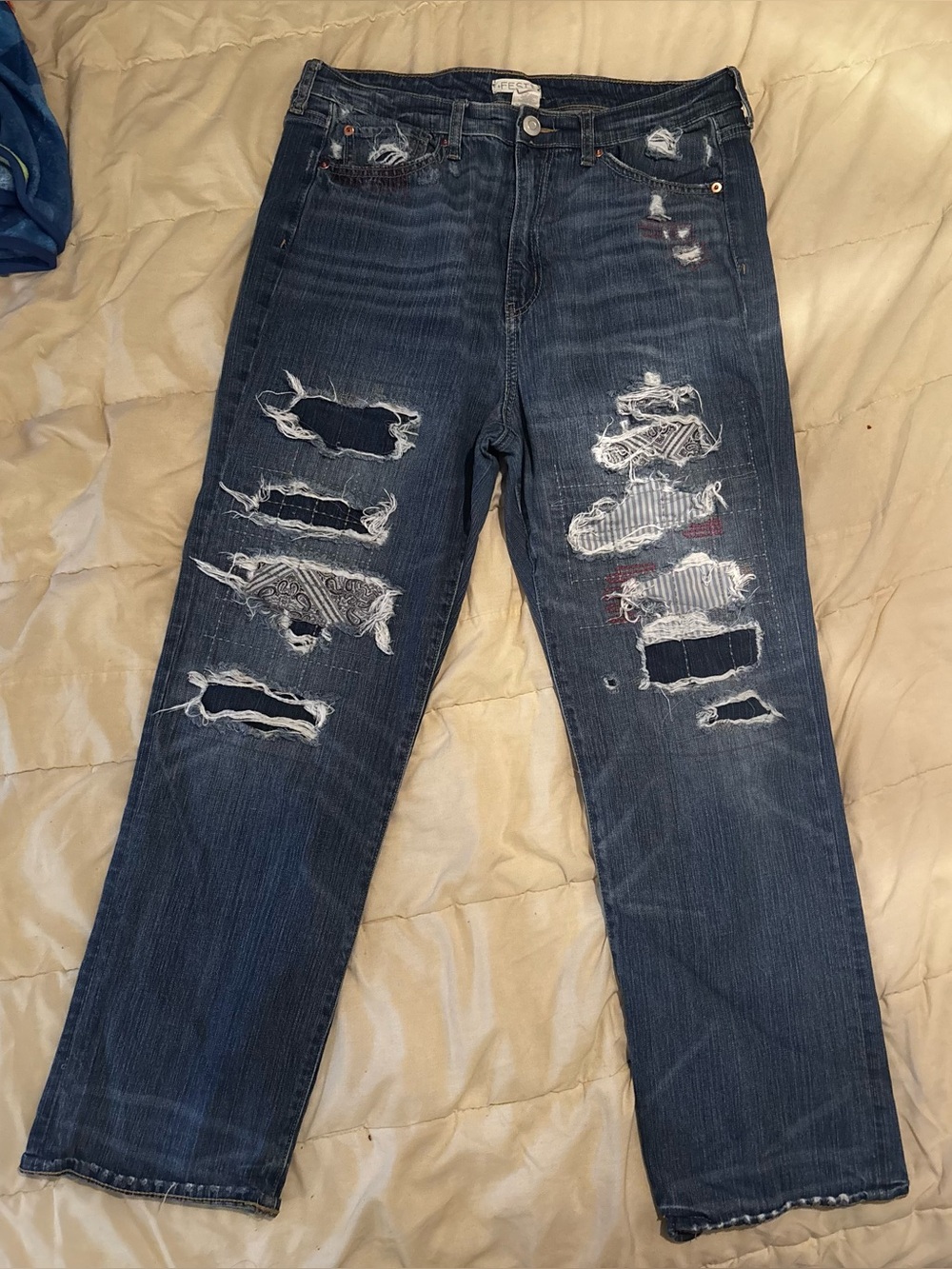 Distressed Women’s Dark Blue Denim Jeans from Torrid